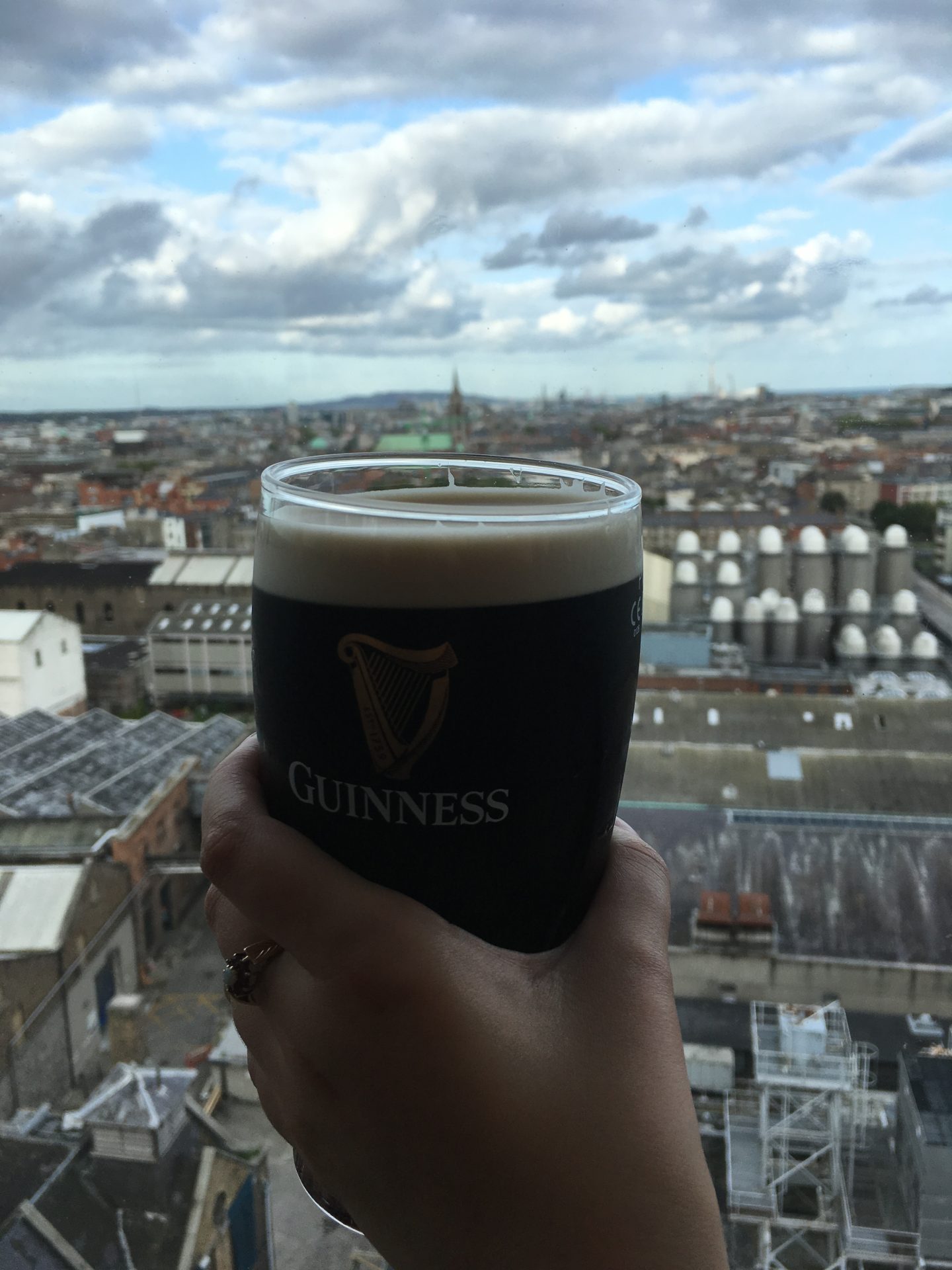 Drinking a guinness with the Dublin skyline in the background
